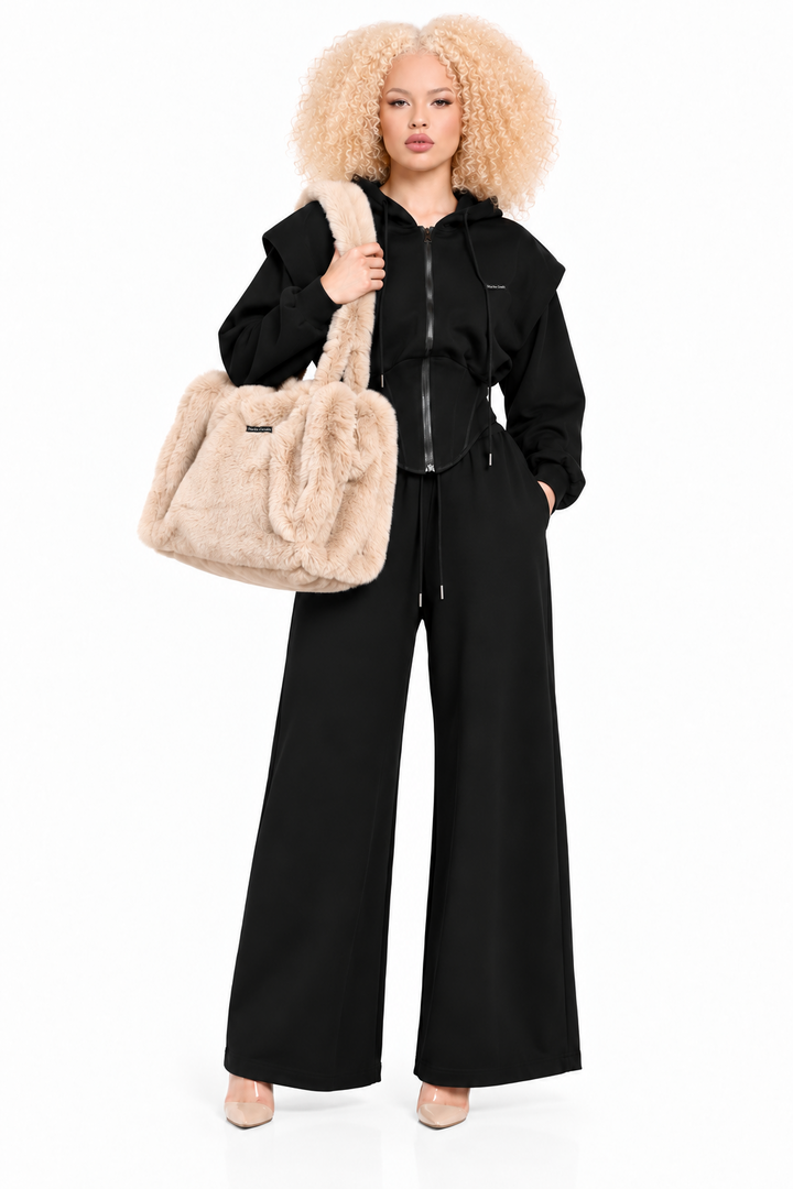  Model wearing a black Starlin Cavalin set carrying the Cozy Muse Bag – Cream
