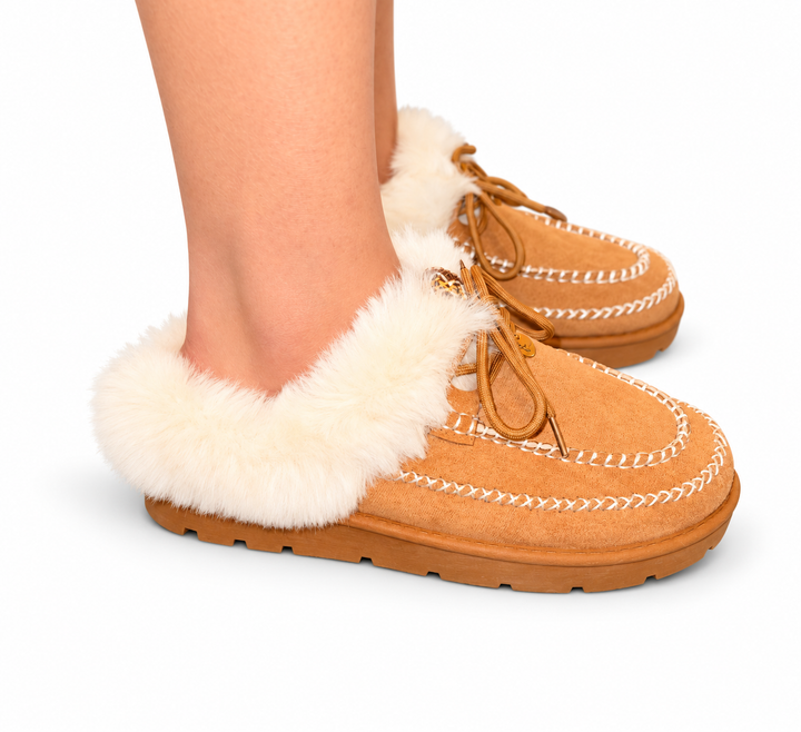 Starlin Cavalin Cozy Luxe Moccasin in camel, worn on foot with soft cream faux-fur trim, contrast stitching and chunky outsole.